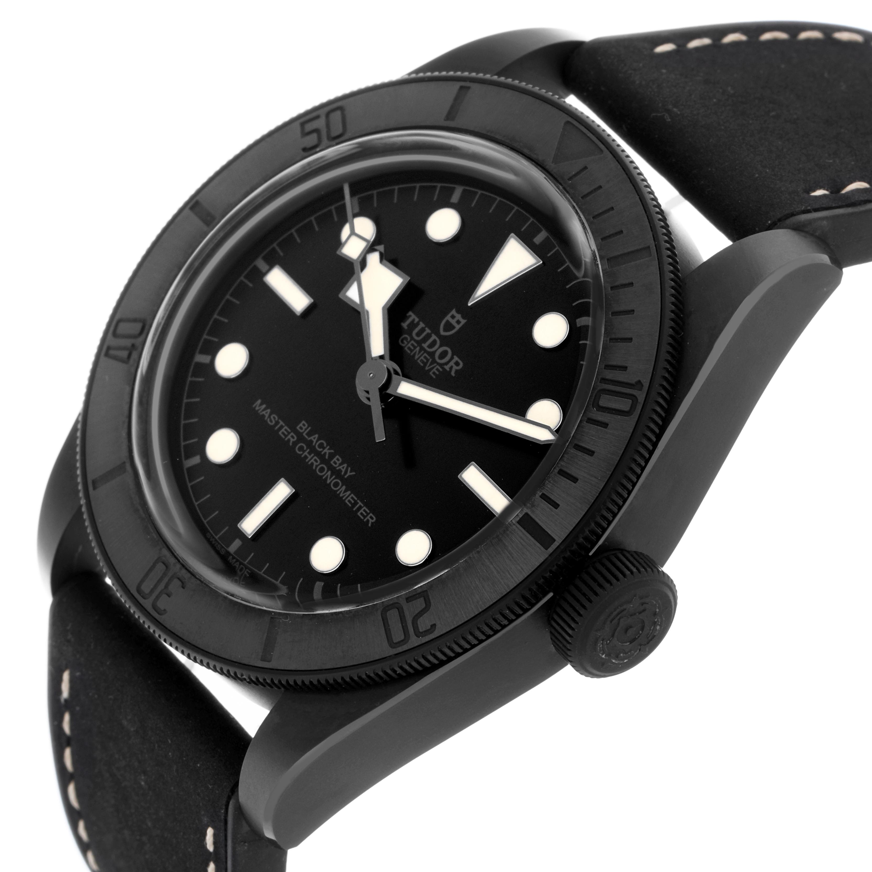 The Tudor Heritage Black Bay 79210 Men
s Ceramic Black Dial 79210 Men
s Ceramic Black Dial watch is shown at a slight angle, featuring its dial, bezel, crown, and part of the strap.